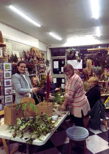 Students at Booker Flowers and Gifts enjoying a flower arranging workshop in Liverpool