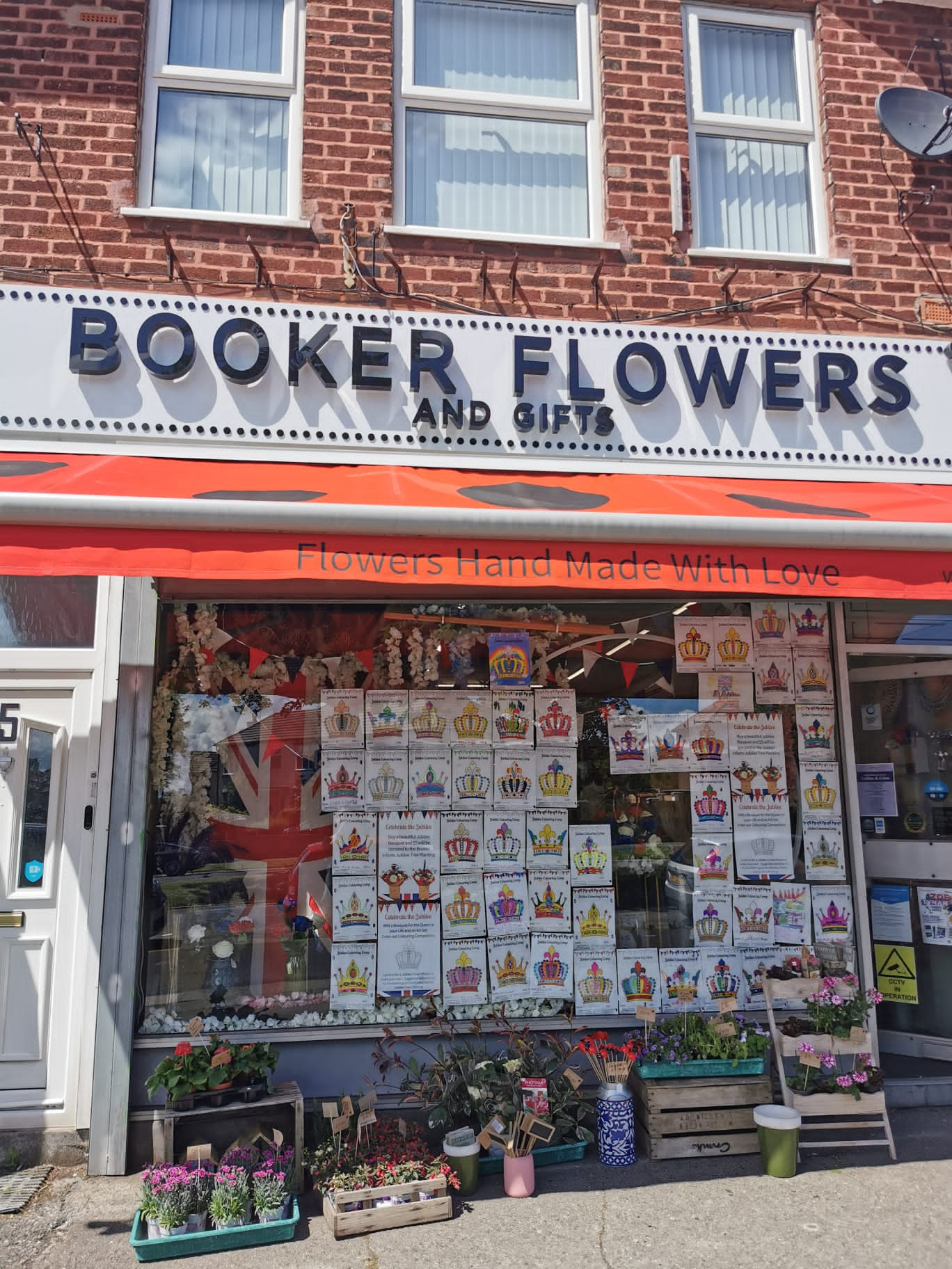 Colourful Crowns decorating the window of Booker Flowers & Gifts 