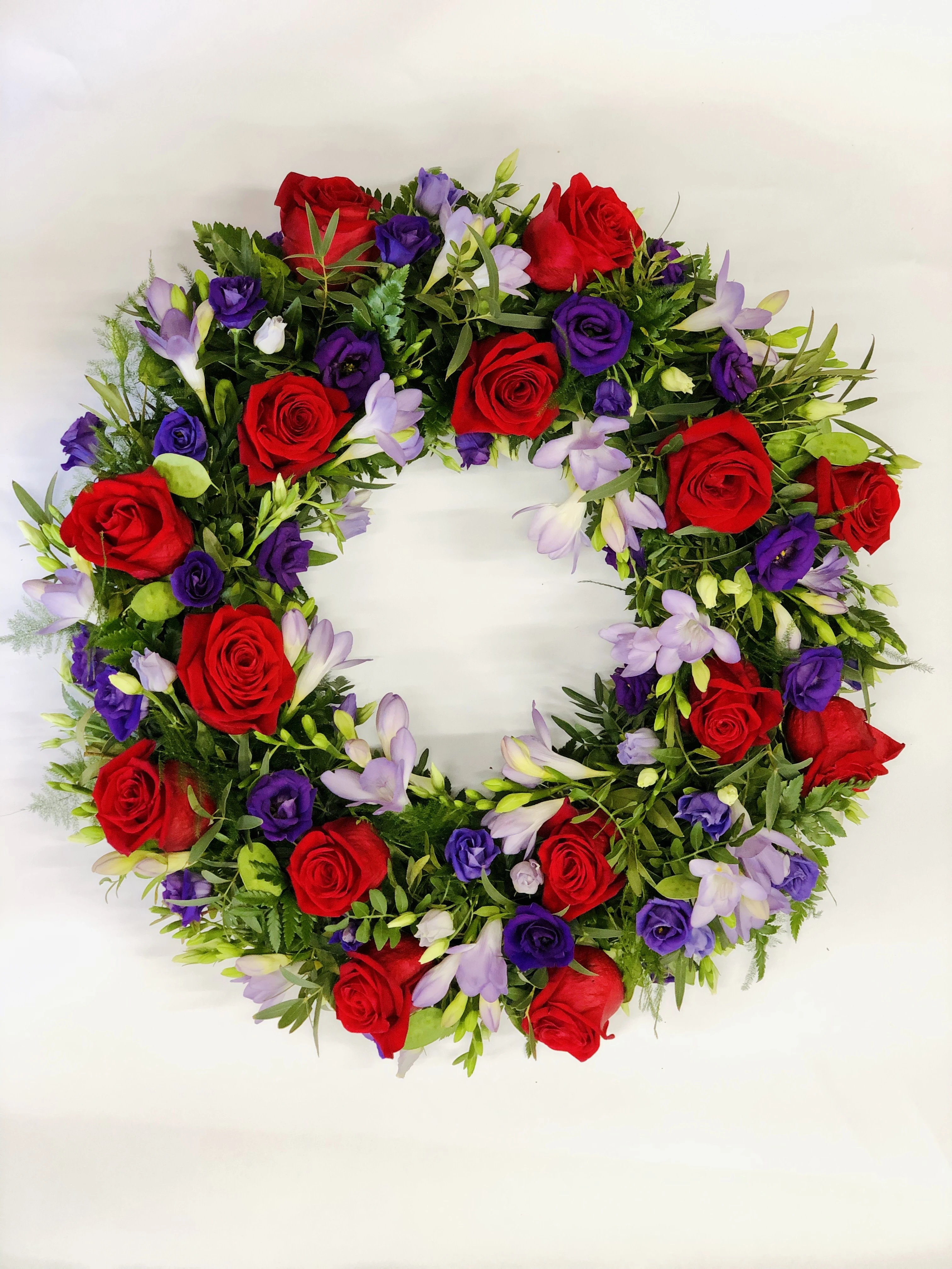 Red Rose and Purple Lisianthus Funeral Wreath Large