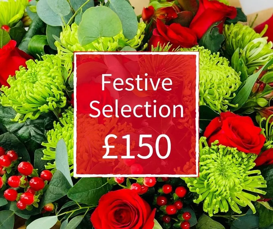 Christmas Florist Choice 150 - Seasonal Handtied Bouquet Christmas Florist Choice 150 - Seasonal Handtied Bouquet