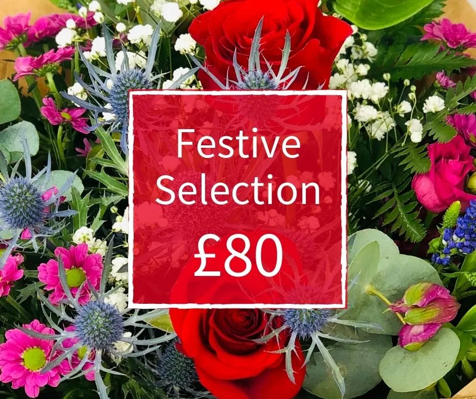 Christmas Florist Choice 80 - Seasonal Handtied Bouquet Christmas Florist Choice 80 - Seasonal Handtied Bouquet